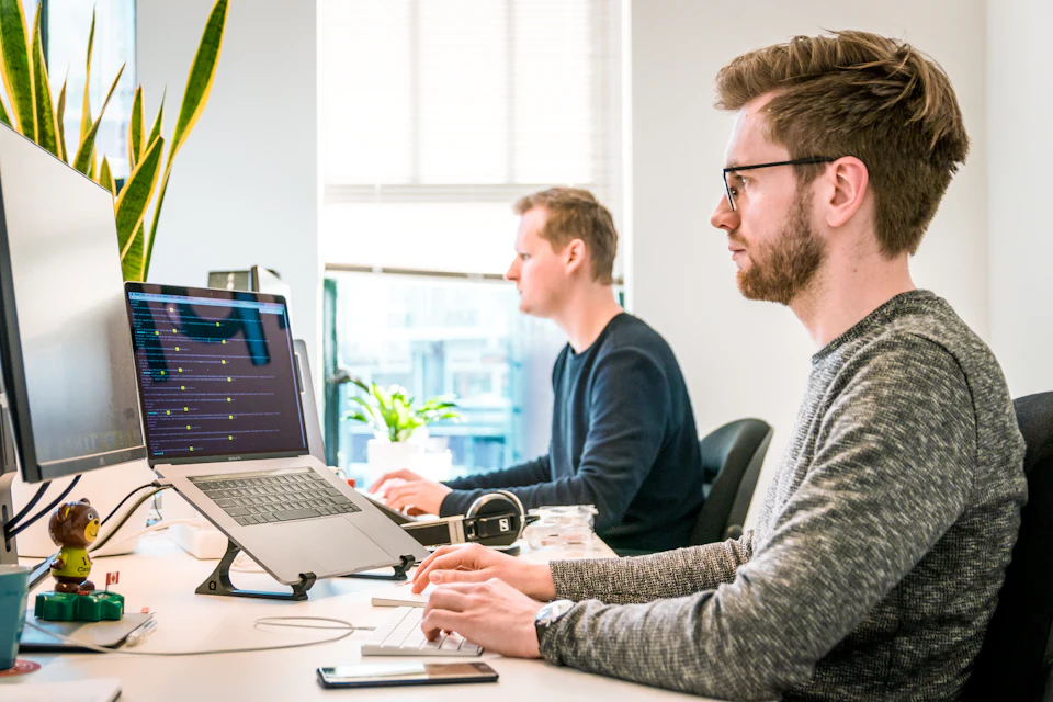 AI Agent Builder Guide: photo of a professional learning with a laptop and course materials