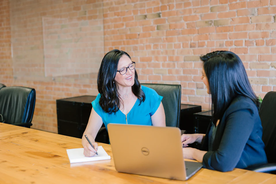 AI Interview Question Generator: photo of a professional at a job interview or reviewing resume documents