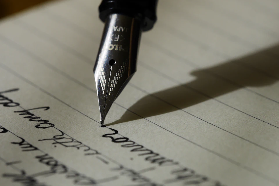 Cover Letter Builder: photo of a professional at a job interview or reviewing resume documents