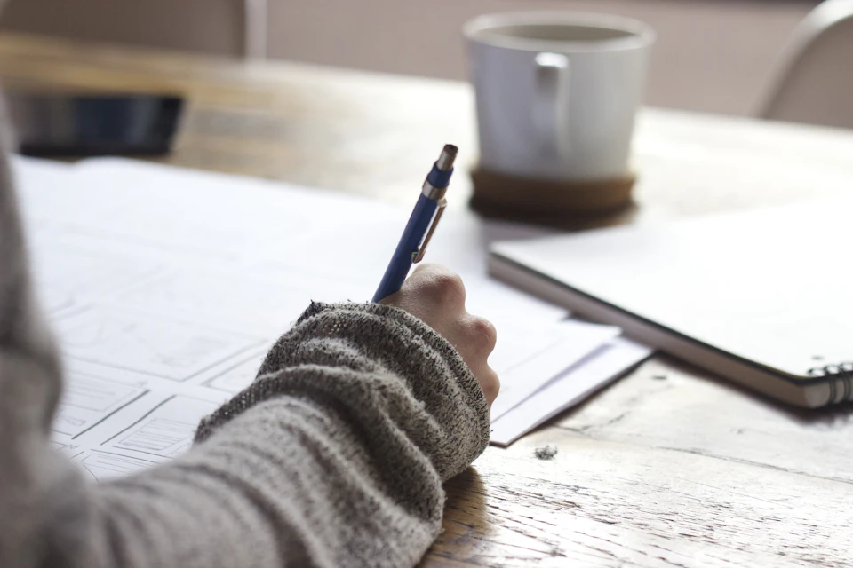 Interview Question Bank: photo of a professional at a job interview or reviewing resume documents