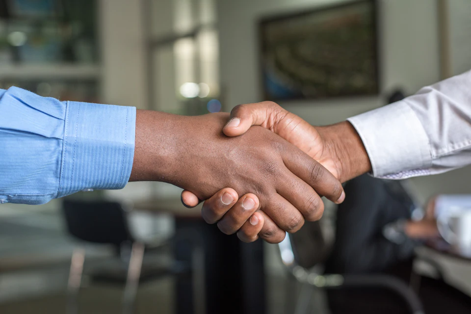 Negotiation Notes: photo of a professional at a job interview or reviewing resume documents