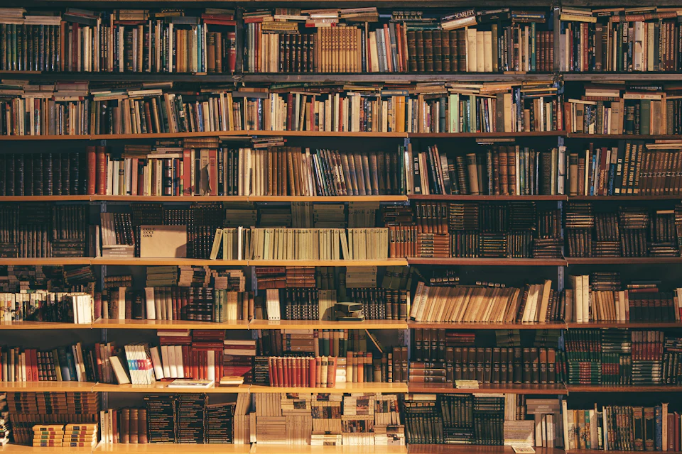 Prompt Library: photo of a professional learning with a laptop and course materials